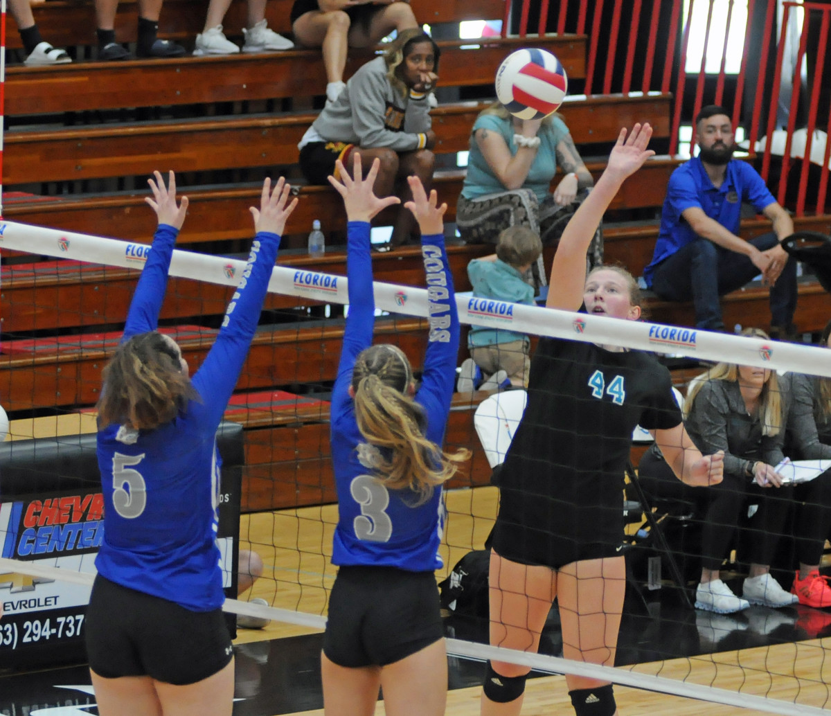 Jensen Beach senior Lindsay Walch (44) tries to tip over Barron Collier's Charlotte Mongin (5) and Chloe Goldenbaum during their Class 5A volleyball final. Walch had 16 kills.